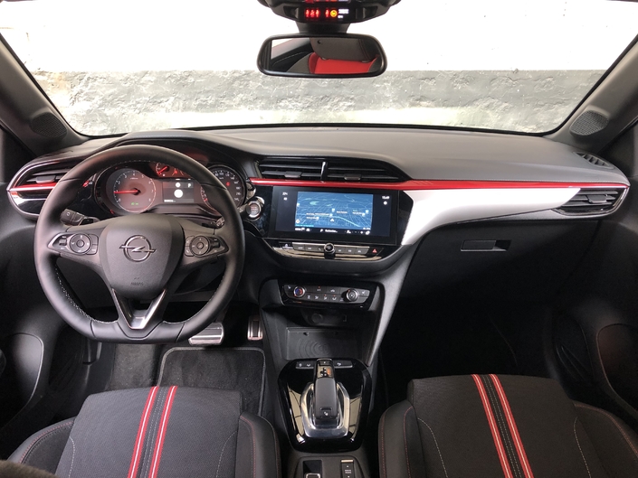 The traditional design of the dashboard contrasts with the eccentricity of the Peugeot 208.